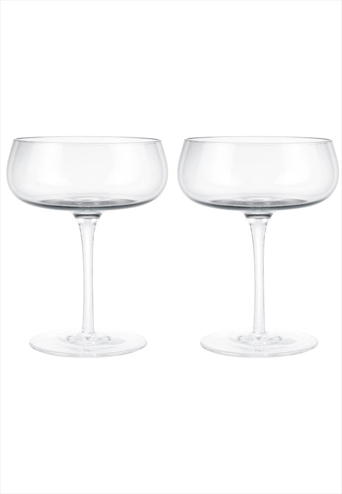 Belo champagnekupa 2-pack. Volym: 20 cl. Mått: H14 cm / D11 cm. Material: Glas (munblåst). Designer: Frederike Martens. Diskmaskinssäker: Ja. Färg: Klar