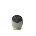 Väckarklocka. Färg: Dusty Olive. Dimbar display. Vattenresistent (IPX4). Roterbar bas. USB-C kabel (inkl). Upp till 30 dagars laddning. 1-2 timmars laddningstid. Material: 100% återvunnen GRS-certifierad ABS-plast/Stål/Silikon.